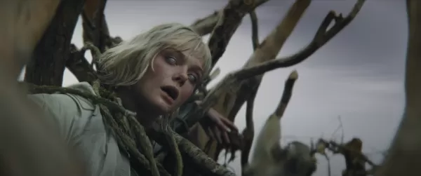 Elle Fanning's eyes displaying Weyland-Yutani logo in Predator: Badlands