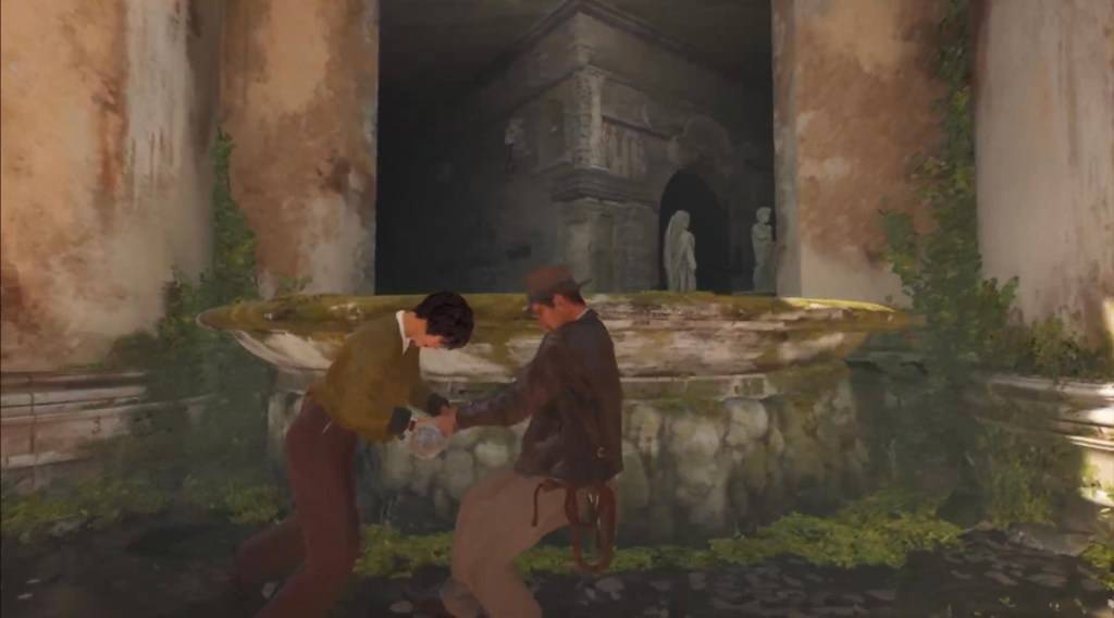 Indy et Gina tirant le levier qui fait partie de la fontaine de puzzle de confession dans l'Indiana Jones et le grand cercle